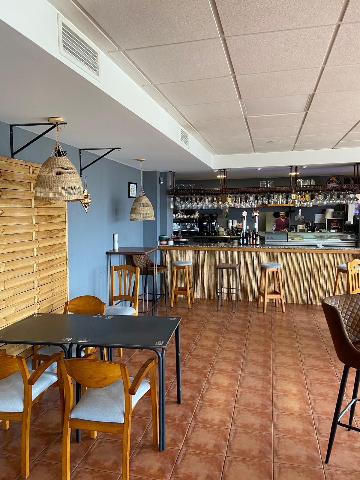 Interior of Restobar Naranjo en Flor with cozy ambiance